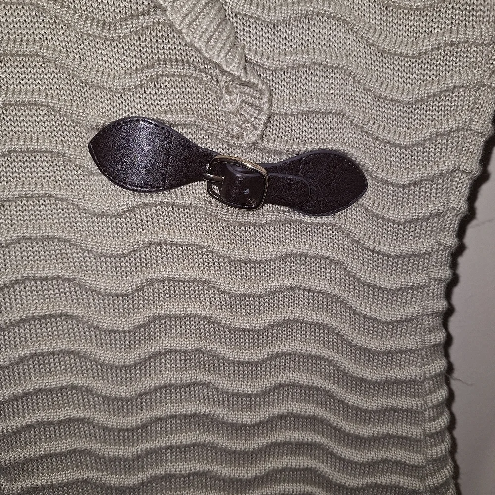 A Calvin Klein faux wrap ribbed knitted sweater dress in a ladies size medium.
